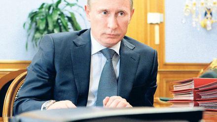 Am Tag der deutschen Einheit nach Berlin: Premier Wladimir Putin. Foto: AFP