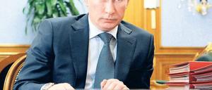 Am Tag der deutschen Einheit nach Berlin: Premier Wladimir Putin. Foto: AFP