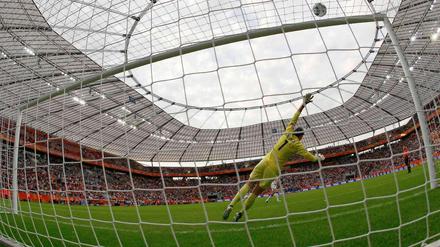 The start of a real sad Saturday: Englands Faye White hits the crossbar with her penalty.