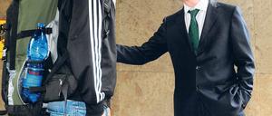 Begrüßung per Handschlag: Minister de Maizière und ein Freiwilliger. Foto: pa/dpa