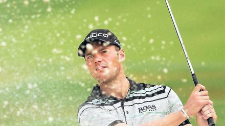 So schlagen Sieger aus dem Bunker. Seit seinem Triumph in Atlanta zählt Martin Kaymer endgültig zur Golfelite. Foto: AFP