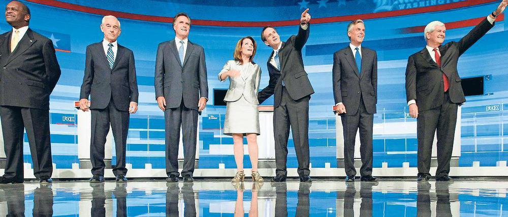 Sie wollen’s werden: Herman Cain, Ron Paul, Mitt Romney, Michele Bachmann, Tim Pawlenty, Jon Huntsman und Newt Gingrich (von links). Rick Santorum fehlt auf dem Bild. Foto: Jim Young/rtr