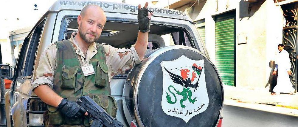 An vorderster Front. Housam Najjair, eigentlich in Irland lebender Bauunternehmer, erreichte mit seinem Jeep als Erster der Rebellen das Zentrum der Hauptstadt.