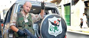 An vorderster Front. Housam Najjair, eigentlich in Irland lebender Bauunternehmer, erreichte mit seinem Jeep als Erster der Rebellen das Zentrum der Hauptstadt. 