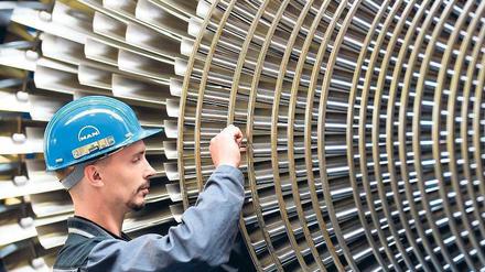 Ein großes Rad. Der deutsche Maschinenbau legt 2011 um 14 Prozent zu. Foto: dpa