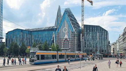 Vieles in Bewegung. Die Baugerüste sind gefallen, der Lehrbetrieb im neuen Hauptgebäude der Uni Leipzig soll 2012 starten. Foto: dpa