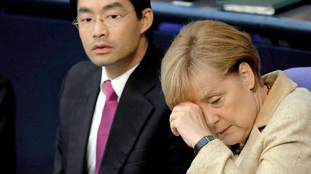 Es war eine Woche der Erschöpfung für Kanzlerin Merkel (CDU) und ihren Vizekanzler Rösler (FDP).