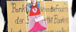 Nur eine Marionette. So sehen jedenfalls Occupy-Demonstranten in Frankfurt am Main Bundeskanzlerin Angela Merkel. Foto: dapd