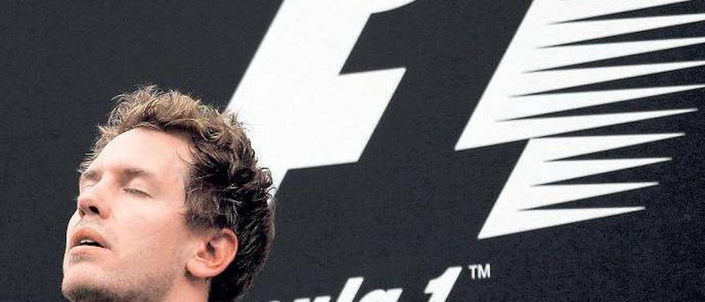 Trauriger Jubel. Sebastian Vettel hatte nach seinem souveränen Erfolg mit gemischten Gefühlen zu kämpfen. Foto: dapd