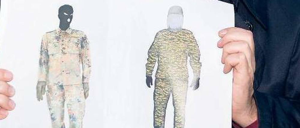 Gesichtslos. Profis wissen, dass Zeugen uniformierte Menschen nicht beschreiben können. Alle achteten auf den Tarnanzug, niemand aufs Gesicht. Ein Polizist zeigt die Phantombilder des mutmaßlichen Täters von Bad Saarow.