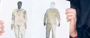 Gesichtslos. Profis wissen, dass Zeugen uniformierte Menschen nicht beschreiben können. Alle achteten auf den Tarnanzug, niemand aufs Gesicht. Ein Polizist zeigt die Phantombilder des mutmaßlichen Täters von Bad Saarow. 