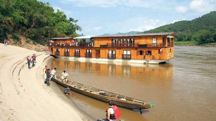 Fernreisen stehen bei Urlaubern hoch im Kurs und sind für die Veranstalter durchaus einträglich. Etwa eine Kreuzfahrt auf dem mittleren Lauf des Mekong durch Laos. 