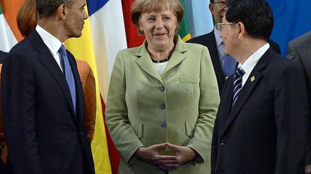 Bundeskanzlerin Angela Merkel zwischen US-Präsident Barack Obama und dem chinesischen Staatspräsidenten Hu Jintao.