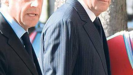 Der Nächste, bitte. Parteifreunde Nicolas Sarkozy (links), Francois Fillon. Foto: AFP