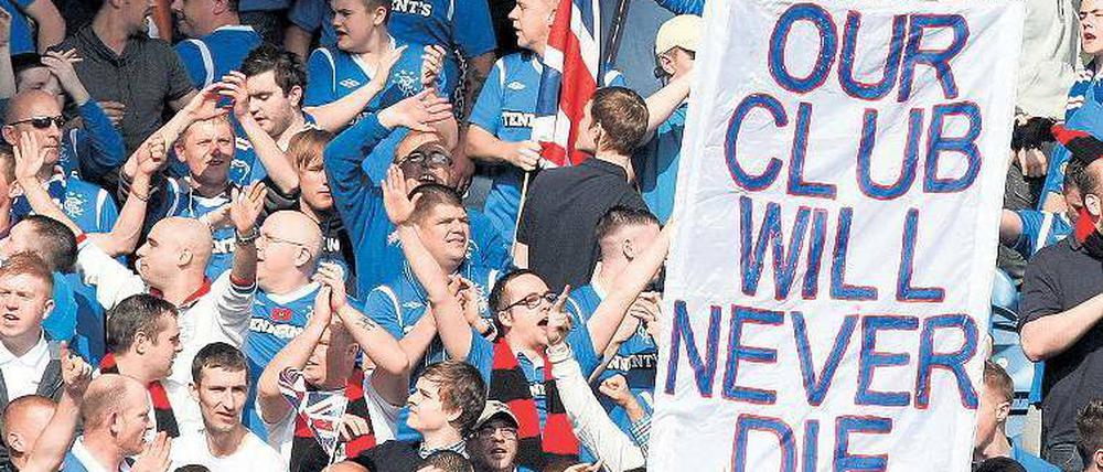 Durchhalteparolen. Die Rangers haben bisher 54 Meisterschaften geholt – eine weitere kommt frühestens in vier Jahren dazu. Foto: dapd