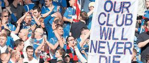 Durchhalteparolen. Die Rangers haben bisher 54 Meisterschaften geholt – eine weitere kommt frühestens in vier Jahren dazu. Foto: dapd