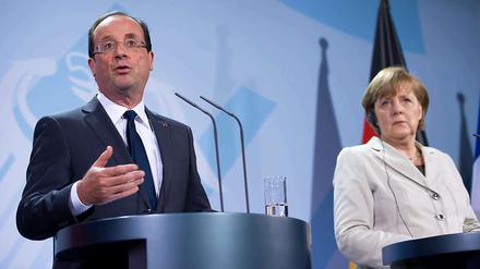 Angela Merkel und François Hollande wollen "alles tun, um Eurozone zu schützen", wie sie am Freitag erklärten.