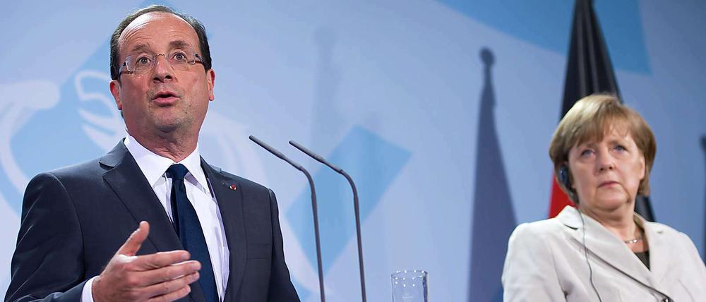 Angela Merkel und François Hollande wollen "alles tun, um Eurozone zu schützen", wie sie am Freitag erklärten.