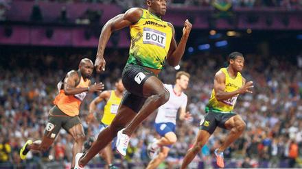 Nicht zu halten. Usain Bolt lag schon in der Kurve fast uneinholbar in Führung. Foto: dpa