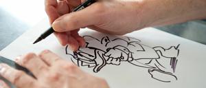 Dauernde Herausforderung: Gulbransson beim Donald-Zeichnen.