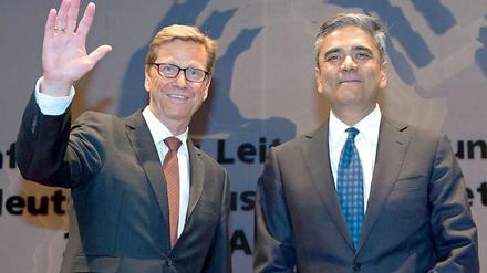 Lächeln mit dem deutschen Außenminister: Deutsche-Bank-Chef Jain (r.).