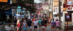 Provincetown, MA - July 20: Foot traffic along Commercial street in Provincetown, MA on July 20, 2021.  Provincetown officials have issued a new mask-wearing advisory for indoors regardless of vaccination status on the latest news data showing that Provincetown COVID cases are increasing. (Photo by Barry Chin/The Boston Globe via Getty Images)