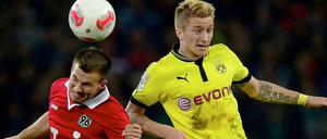 Konnten dem Spiel ihrer Mannschaft diesmal nicht ihren Stempel aufdrücken: Hannovers Szabolcs Huszti (l.) und Dortmunds Marco Reus.