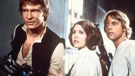 Die Zukunft von gestern. Harrison Ford, Carrie Fisher und Mark Hamill spielten 1977 die Hauptrollen in „Krieg der Sterne“. Fünf weitere „Star-Wars“-Filme folgten, wobei der erste Teil heute auf Grund seines Platzes in der Chronologie „Episode IV“ heißt. 