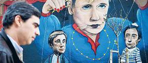 Ist Angela Merkel diejenige, nach deren Pfeife alle tanzen? Die portugiesische Protestbewegung zumindest hält ihre eigene Regierung für willfährige Marionetten.