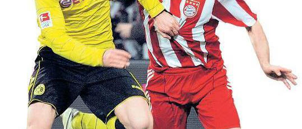 Wer hält wen auf? Münchens Ribéry (r.) und der Dortmunder Piszczek. Foto: dpa