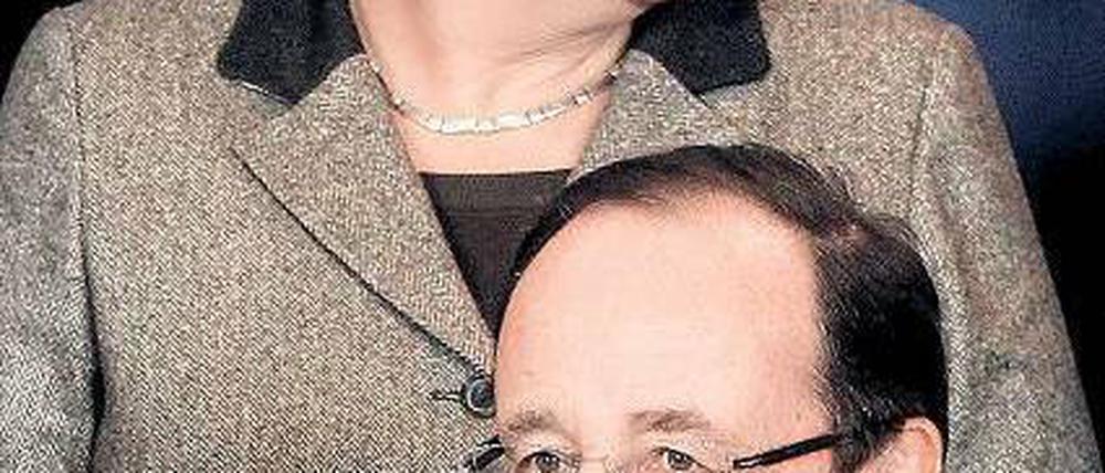 Pariser Überraschungen: Die Kanzlerin und Frankreichs Präsident Foto: dpa