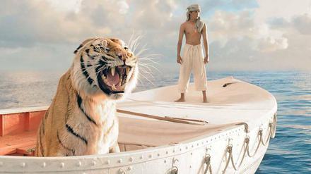 Reisegefährten. Großkatze und Jungmann (Suraj Sharma) in „Life of Pi“, der in 25 Berliner Kinos zu sehen ist. 