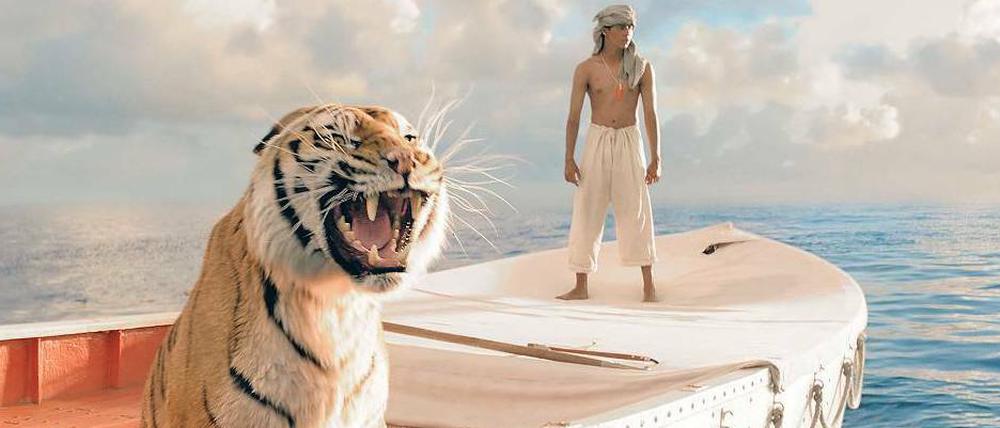 Reisegefährten. Großkatze und Jungmann (Suraj Sharma) in „Life of Pi“, der in 25 Berliner Kinos zu sehen ist. 