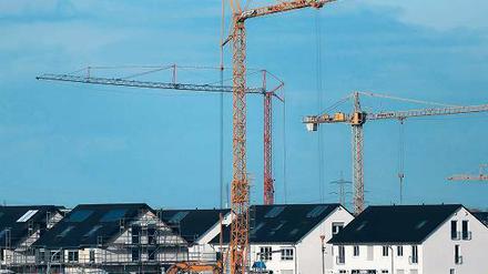 Frei stehende Häuser sind teurer in Bau und Unterhalt. Foto: dpa