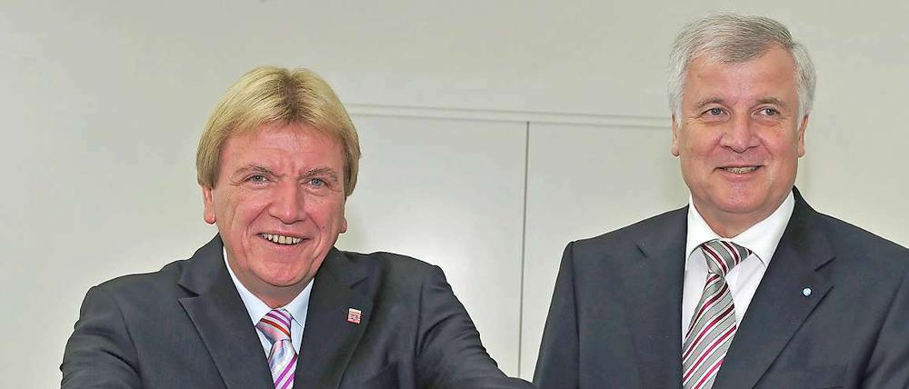 Sie wollen, dass ihre Länder von dem Erwirtschafteten mehr behalten dürfen: Hessens Ministerpräsident Volker Bouffier (links) und Bayerns Regierungschef Horst Seehofer.