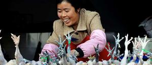 Stille Gefahr. Asiatische Geflügelmärkte gelten als mögliche Ansteckungsquelle für die Vogelgrippe.