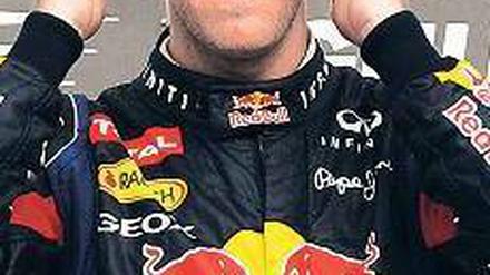 Nachmittag in Bahrain, Frisur sitzt. Formel-1-Weltmeister Sebastian Vettel musste sich in Manama bei seiner souveränen Fahrt nicht verausgaben. Foto: AFP