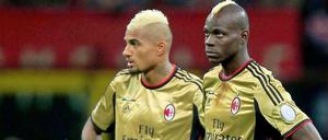 Kein schöner Land: AC Mailands dunkelhäutige Spieler Kevin-Prince Boateng (l.) und Mario Balotelli nach dem Spielabbruch gegen den AS Rom.