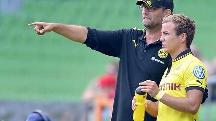 Hofft auf seine Unterstützung. Doch momentan sieht es nicht so gut aus für Jürgen Klopps (links) Offensivstrategen Mario Götze.