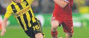 Hiergeblieben. Franck Ribéry (r.) will beim FC Bayern bis 2017 verlängern. Foto: AFP