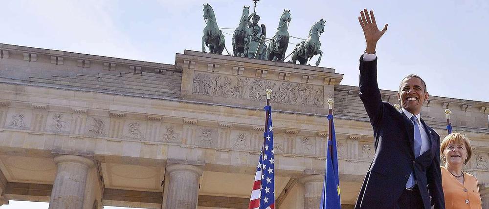 Barack Obama und Angela Merkel vor dem Brandenburger Tor. 