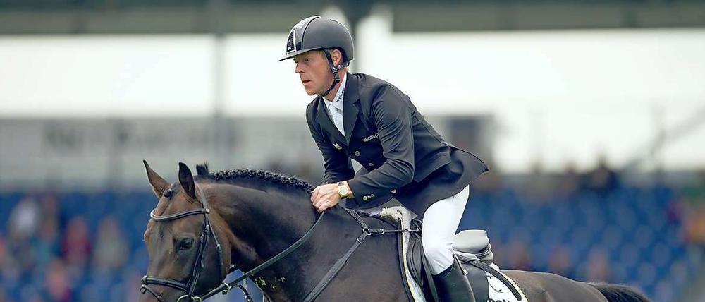 Auf dem Sprung in Aaachen. Marcus Ehning auf dem Pferd Singular la Silla. 