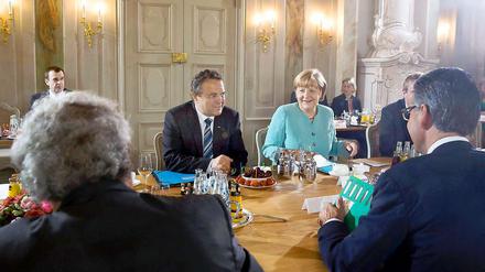 Bundeskanzlerin Angela Merkel (CDU) und Bundesinnenminister Hans-Peter Friedrich (CSU).