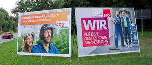 Plakate von CDU und SPD.