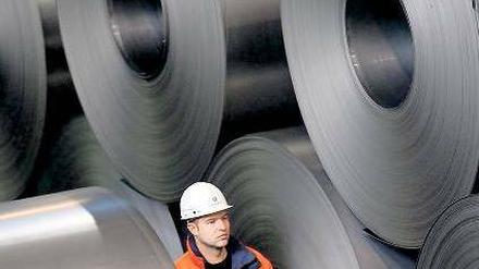 Von der Rolle. 2013 wird die Wirtschaft kaum wachsen – anziehende Investitionen der Unternehmen und der Konsum der Bürger werden 2014 zu einem besseren Jahr machen. Foto: dpa