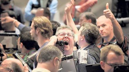 Überrascht und erleichtert. Händler an den Aktien- und Terminbörsen brachen nach der Entscheidung der US-Notenbank in Jubel aus.