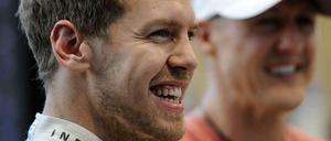 Weltmeister unter sich: Sebastian Vettel (v.) und Michael Schumacher.