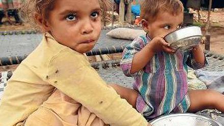 Sattwerden. Indien verkauft Reis und Getreide an Arme zu staatlich festgelegten Preisen. Das darf es nun auch weiter tun. Foto: picture alliance/dpa