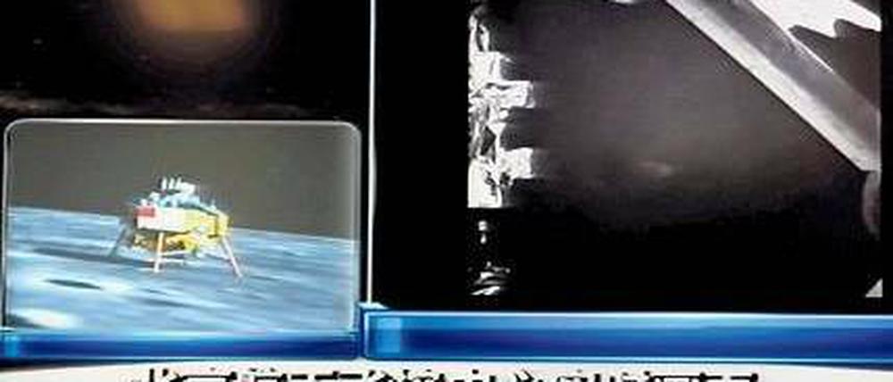 Gelandet. Diese unscharfen Bilder zeigte das chinesische Staatsfernsehen am Sonnabend. Foto: AFP