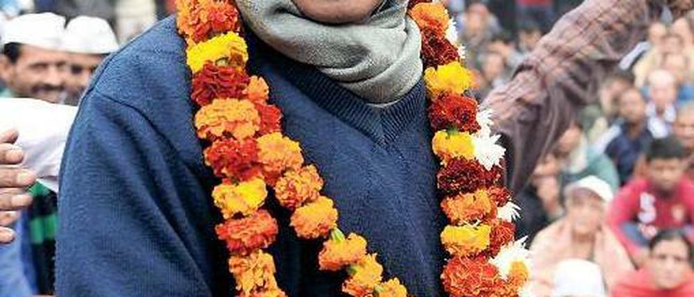 Einer für alle. Arvind Kejriwal und seine Partei sind beliebt bei den kleinen Leuten. Dass sie es überhaupt an die Macht schafften, gilt als Überraschung. Foto: Sajjad Hussain/AFP